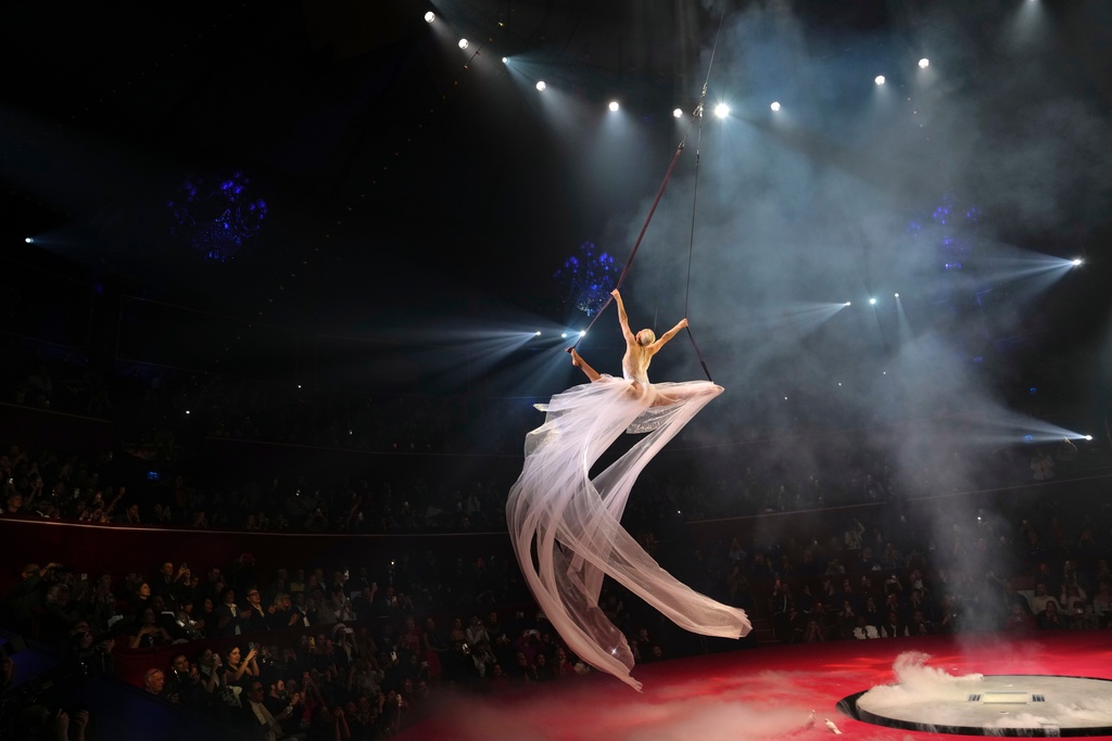 An acrobat performs at the Stephane Rolland Spring/Summer 2026 Haute Couture collection presented in Paris, Tuesday, Jan. 27, 2026. (AP Photo/Aurelien Morissard)