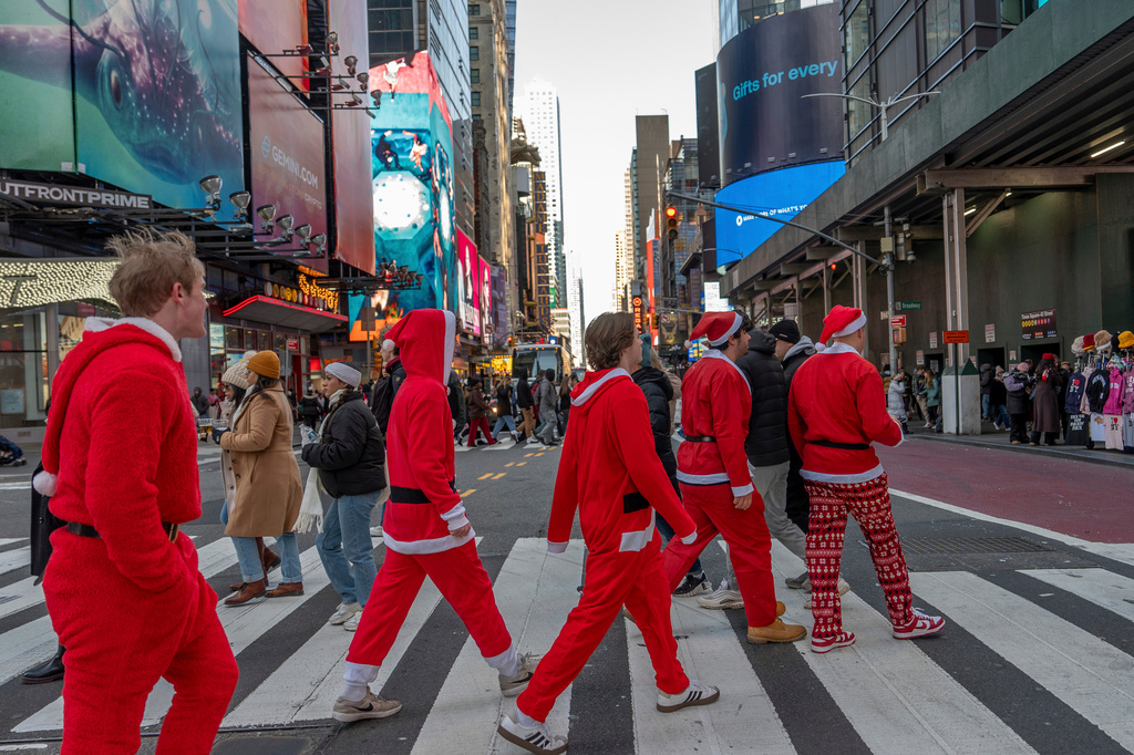 FILE - Revelers take part in SantaCon, Dec. 14, 2024, in New York. (AP Photo/Julia Demaree Nikhinson, File)