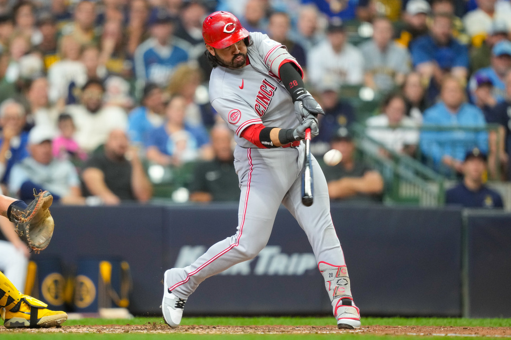 Cincinnati Reds' Eugenio Suárez hits a three-run home run during the sixth inning of a baseball game against the Milwaukee Brewers, Sunday, Sept. 13, 2026, in Milwaukee. (AP Photo/Kayla Wolf)
