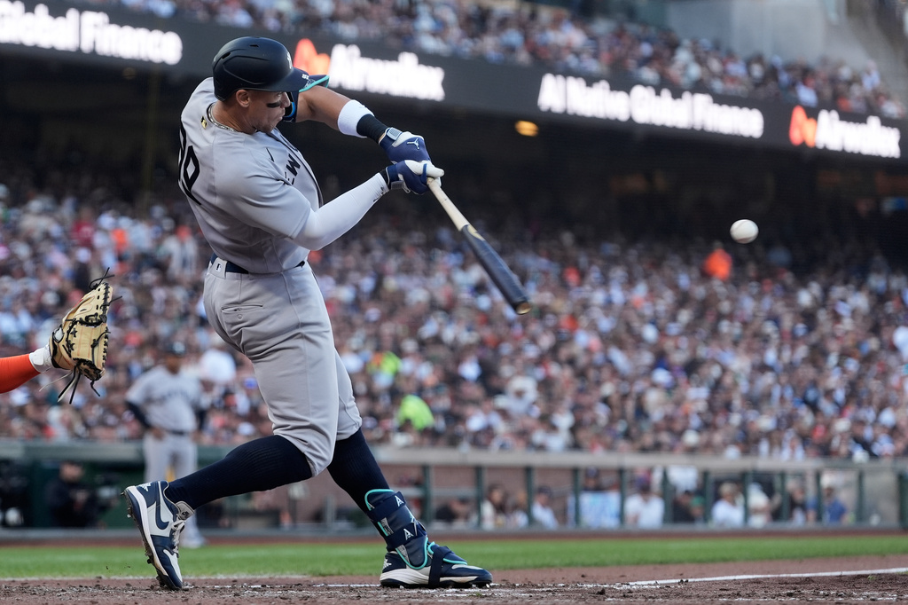 New York Yankees' Aaron Judge hits a home run against the San Francisco Giants during the fifth inning of a baseball game in San Francisco, Saturday, March 28, 2026. (AP Photo/Jeff Chiu)