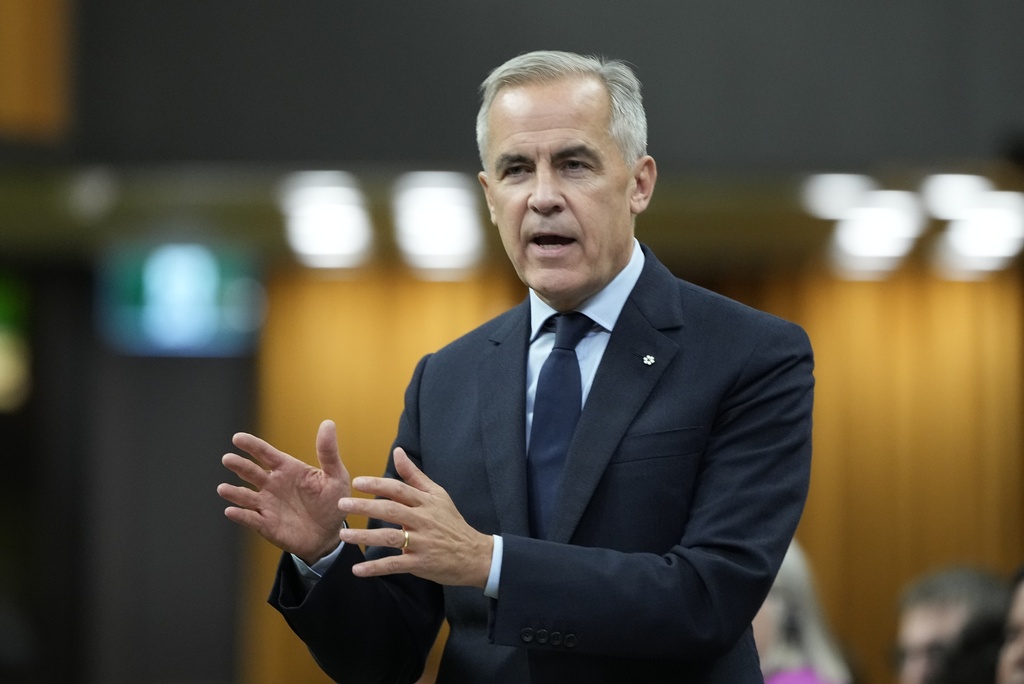 Canada Prime Minister Mark Carney rises during Question Period on Parliament Hill in Ottawa, Canada, Thursday, Oct. 2, 2025. (Adrian Wyld/The Canadian Press via AP)