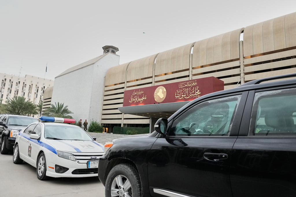 Members of the Iraqi parliament arrive at the hall of the parliament to elect a president of the republic in Baghdad, Iraq, Saturday, April 11, 2026. (AP Photo/Hadi Mizban)