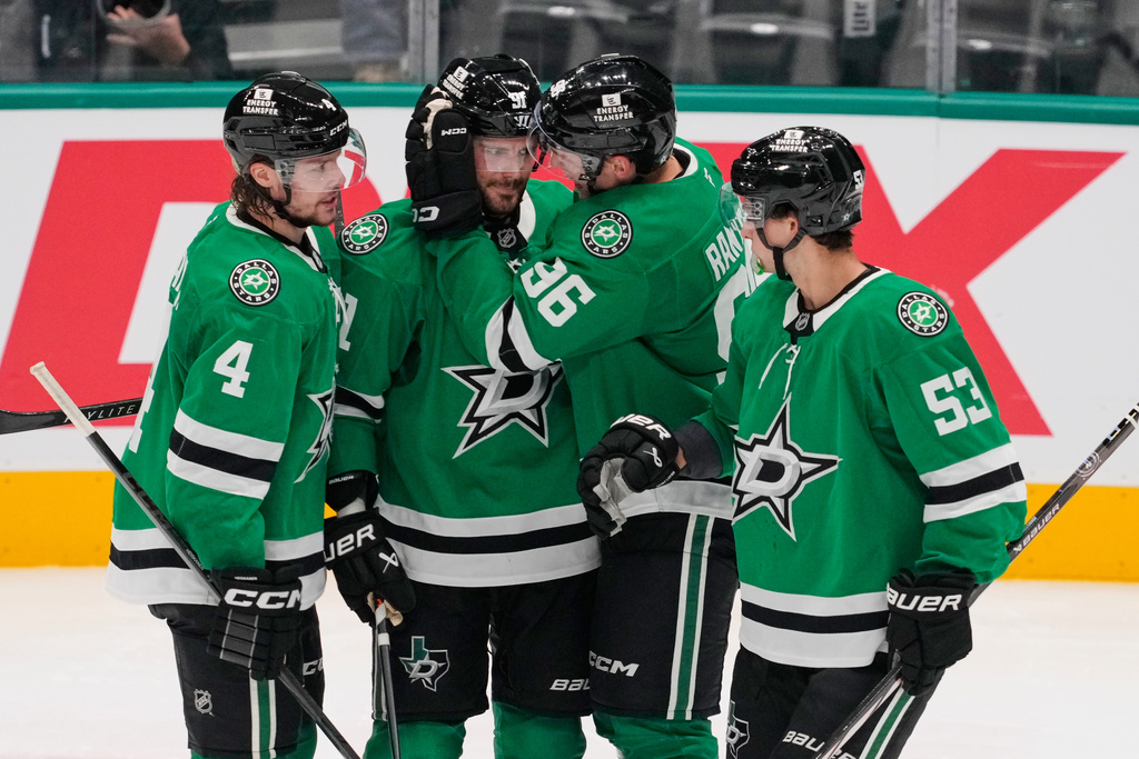 Dallas Stars' Miro Heiskanen (4), Tyler Seguin, second from left, Mikko Rantanen (96) and Wyatt Johnston (53) celebrate a goal scored by Seguin in the second period of an NHL hockey game against the Washington Capitals Tuesday, Oct. 28, 2025, in Dallas. (AP Photo/Tony Gutierrez)