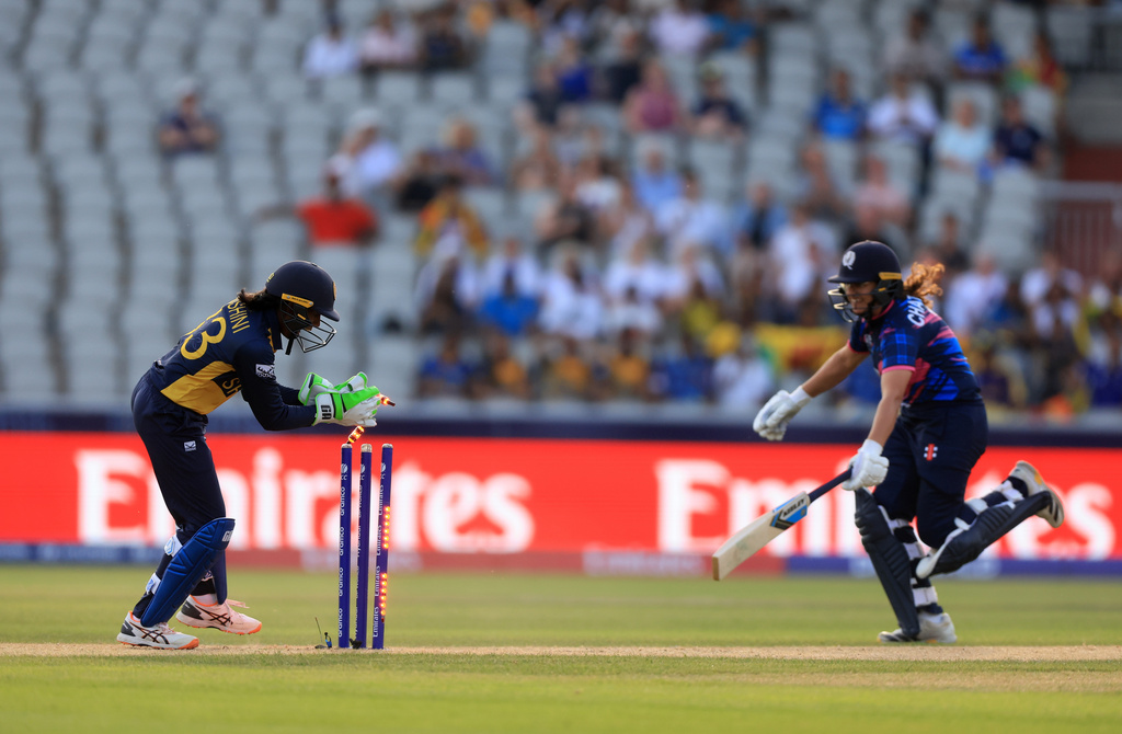 Scotland's Priyanaz Chatterji is ran out by Sri Lanka's Kaushini Nuthyangana during the ICC Women's T20 World Cup match at Emirates Old Trafford in Manchester, England, on Friday June 26, 2026. (Nigel French/PA via AP)