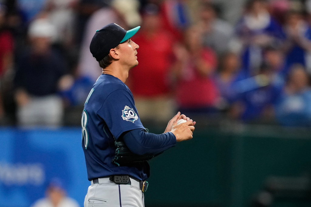 Seattle Mariners pitcher George Kirby stands behind the mound after giving up a two-run home run to Texas Rangers' Jake Burger in the third inning of a baseball game in Arlington, Texas, Monday, July 27, 2026. (AP Photo/Tony Gutierrez)