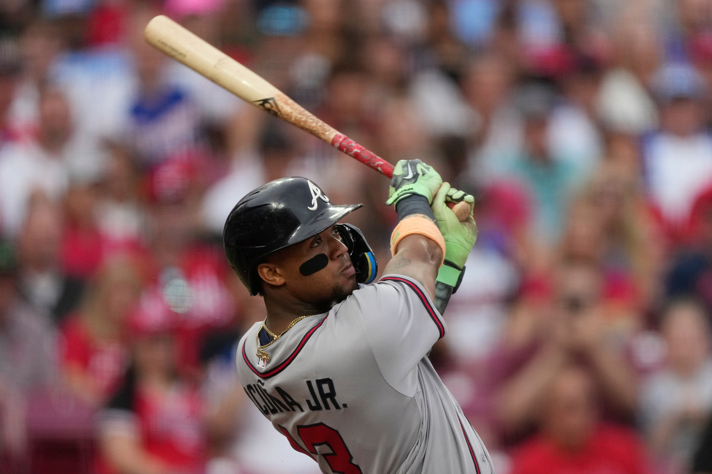 Atlanta Braves right fielder Ronald Acuña Jr. watches his solo home run during the third inning of a baseball game against the Cincinnati Reds in Cincinnati, Saturday, May 30, 2026. (AP Photo/Carolyn Kaster)