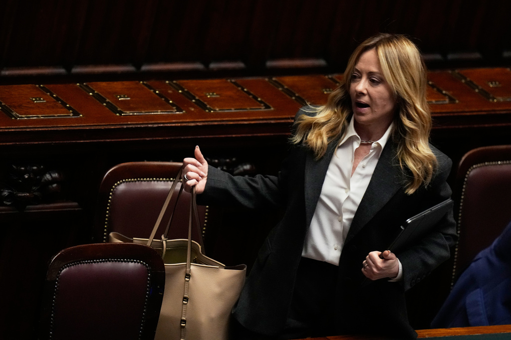 Italian Premier Giorgia Meloni leaves the lower chamber of parliament in Rome, Thursday, April 9, 2026. (AP Photo/Alessandra Tarantino)