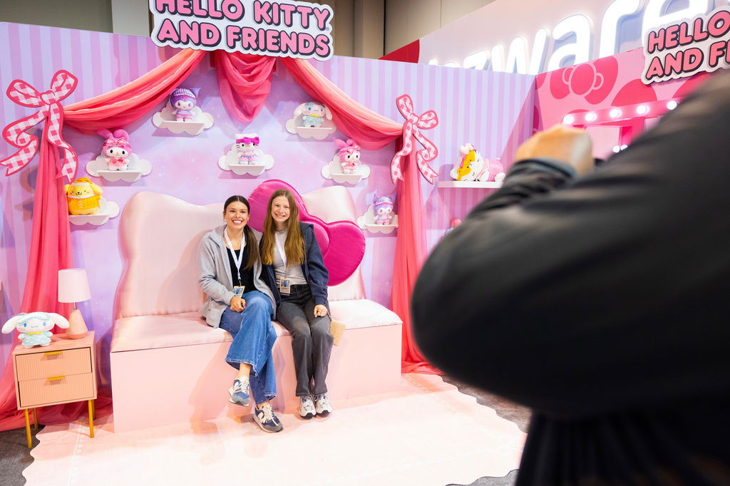 Shareholder Anna Larsen, 16, left, of Underwood, Iowa, poses for photo with her friend Ainsley Roberts, 17, in the Hello Kitty portion of the Squishmallows display in the Berkshire Hathaway annual meeting on Saturday, May 2, 2026, in Omaha, Neb. (AP Photo/Rebecca S. Gratz)