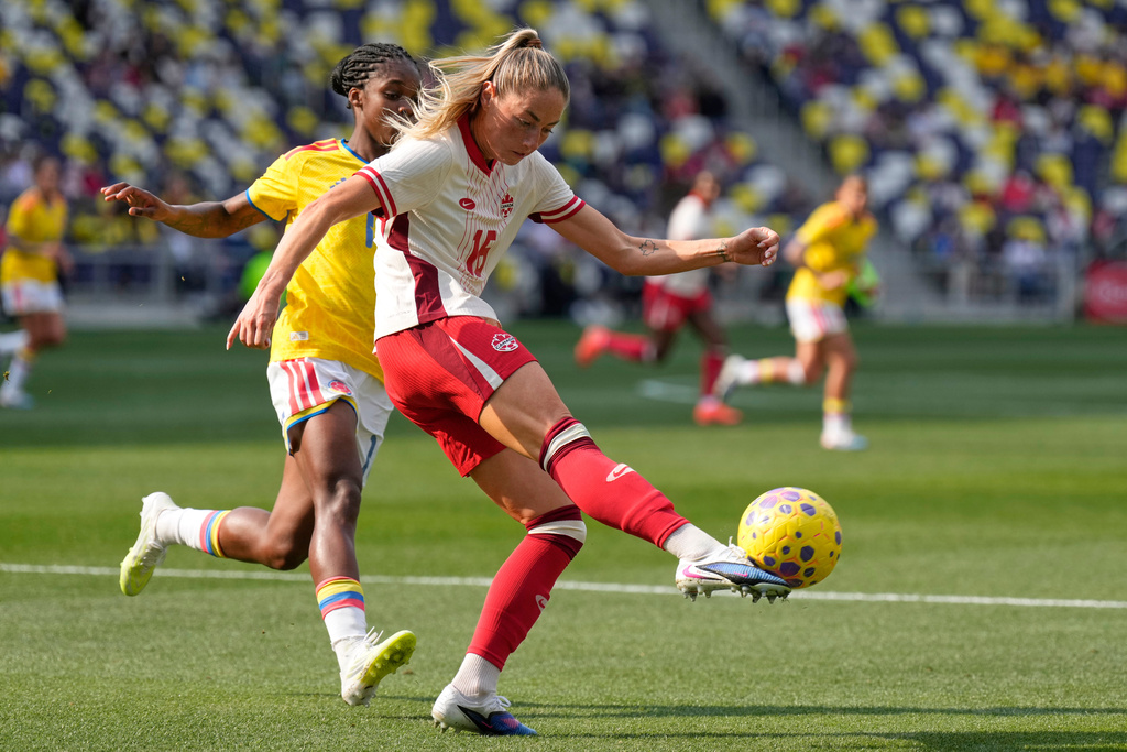 Canada forward Janine Sonis (16) kicks the ball past Colombia midfielder Linda Caicedo, left, during the second half of a SheBelieves Cup women's soccer tournament match Sunday, March 1, 2026, in Nashville, Tenn. (AP Photo/George Walker IV)