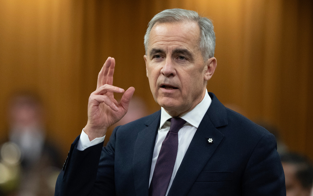Canadian Prime Minister Mark Carney rises during Question Period, on Parliament Hill in Ottawa, Monday, Nov. 17, 2025. (Adrian Wyld/The Canadian Press via AP)