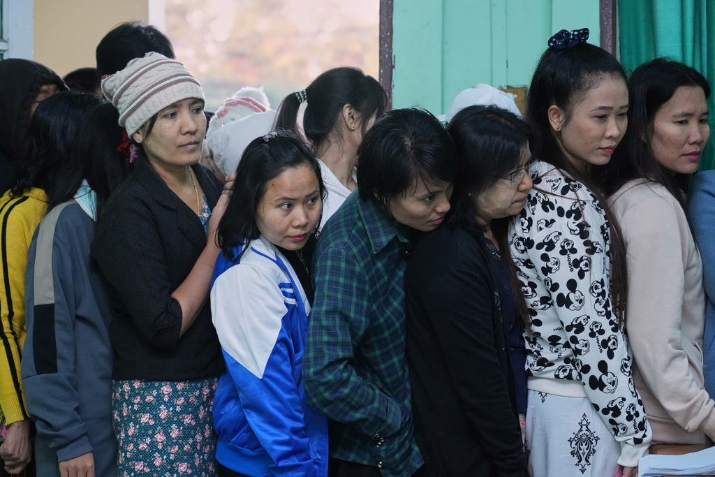 Voters line up to cast their ballots at a polling station in Naypyitaw, Myanmar, Sunday, Dec. 28, 2025. (AP Photo/Aung Shine Oo)