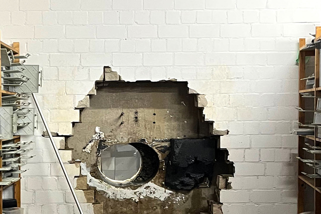 This picture, provided by the Gelsenkirchen Police on Monday, Dec. 29, 2025 shows a hole in a wall of the savings bank branch in the Buer district in Gelsenkirchen, Germany. (Police Gelsenkirchen via AP)