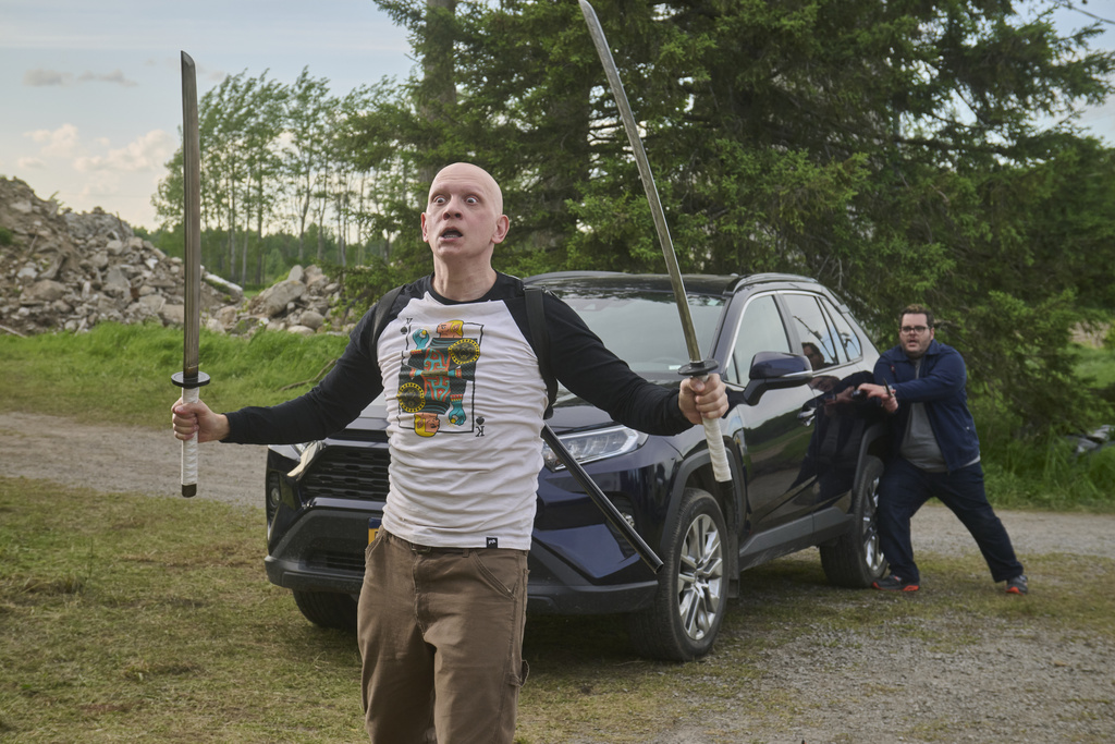 This image released by Republic Pictures shows Anthony Carrigan, left, and Josh Gad in a scene from "Adulthood." (Albert Camicioli/Republic Pictures via AP)