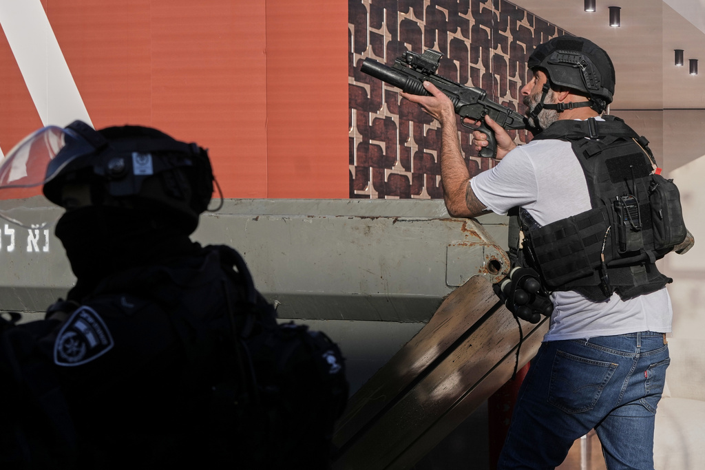 Israeli police officers work to restore order during a violent disturbance by Ultra-Orthodox Jewish protesters in Jerusalem, Thursday, Dec. 18, 2025. (AP Photo/ Mahmoud Illean)
