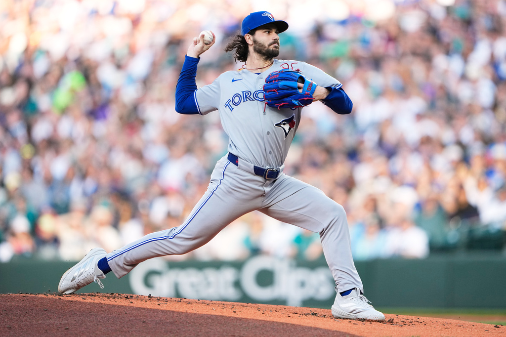 Toronto Blue Jays starting pitcher Dylan Cease throws against the Seattle Mariners during the first inning of a baseball game, Friday, July 3, 2026, in Seattle. (AP Photo/Lindsey Wasson)