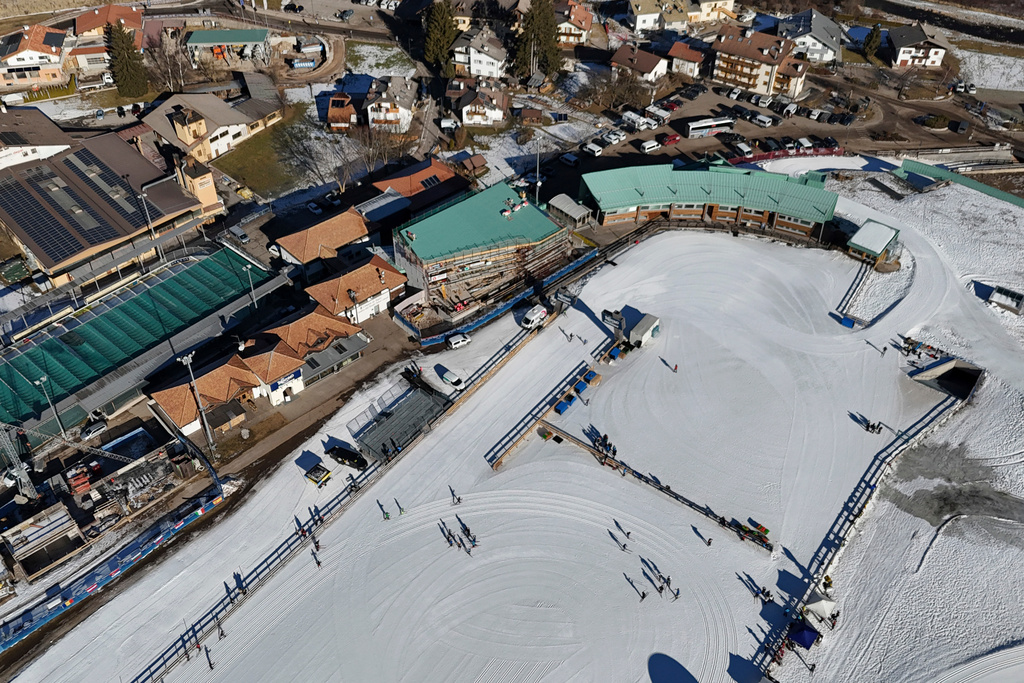 FILE - Skiers are seen from above at the Cross Country skiing stadium which will be used at the Milan Cortina 2026 Winter Olympics, in Tesero, Italy, Friday, Jan. 17, 2025. (AP Photo/Luca Bruno, File)