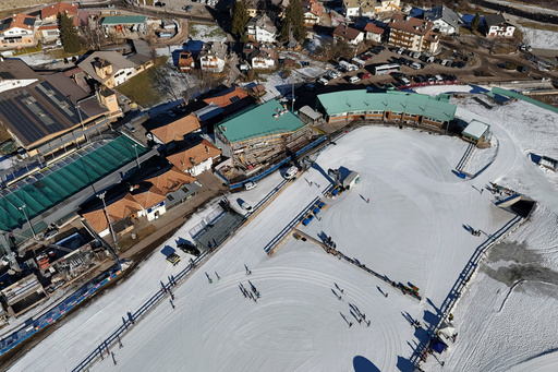 FILE - Skiers are seen from above at the Cross Country skiing stadium which will be used at the Milan Cortina 2026 Winter Olympics, in Tesero, Italy, Friday, Jan. 17, 2025. (AP Photo/Luca Bruno, File) FILE - Skiers are seen from above at the Cross Country skiing stadium which will be used at the Milan Cortina 2026 Winter Olympics, in Tesero, Italy, Friday, Jan. 17, 2025. (AP Photo/Luca Bruno, File)