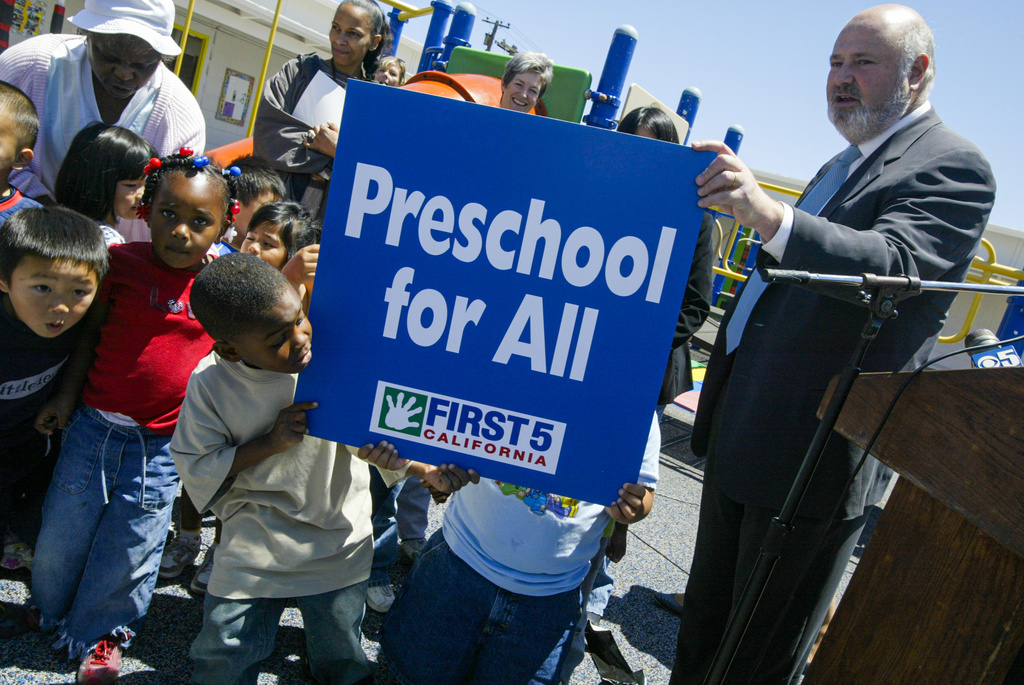 Rob Reiner, director, Castle Rock Entertainment, and First 5 California chairman, speaks at Visitacion Valley Family School to kick-off the city's universal preschool program, in San Francisco, June 2, 2004. (Kat Wade/San Francisco Chronicle via AP)