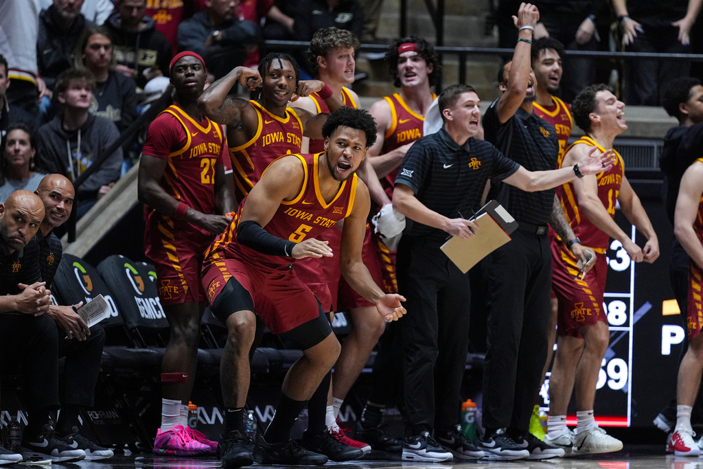 Iowa State forward Joshua Jefferson (5) and the bench celebrates during the second half of an NCAA college basketball game against Purdue in West Lafayette, Ind., Saturday, Dec. 6, 2025. (AP Photo/Michael Conroy)
