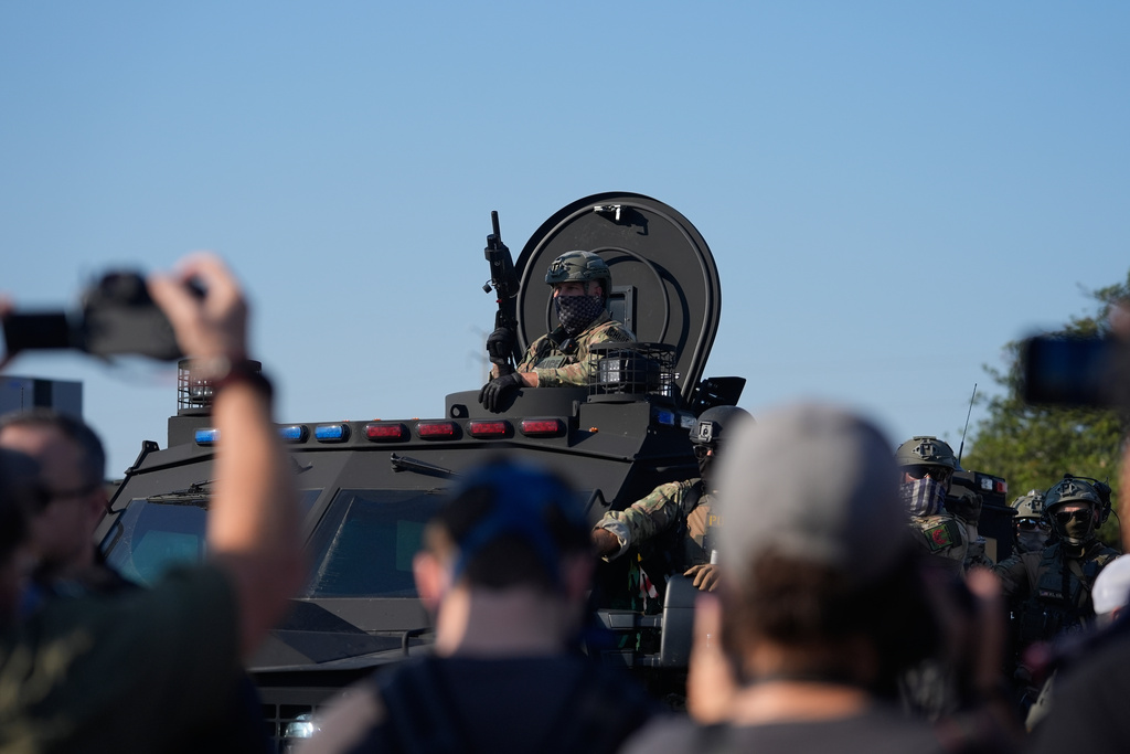 Federal law enforcement arrive near an Immigration and Customs Enforcement facility in Broadview, Ill., Friday, Oct. 3, 2025. (AP Photo/Erin Hooley)