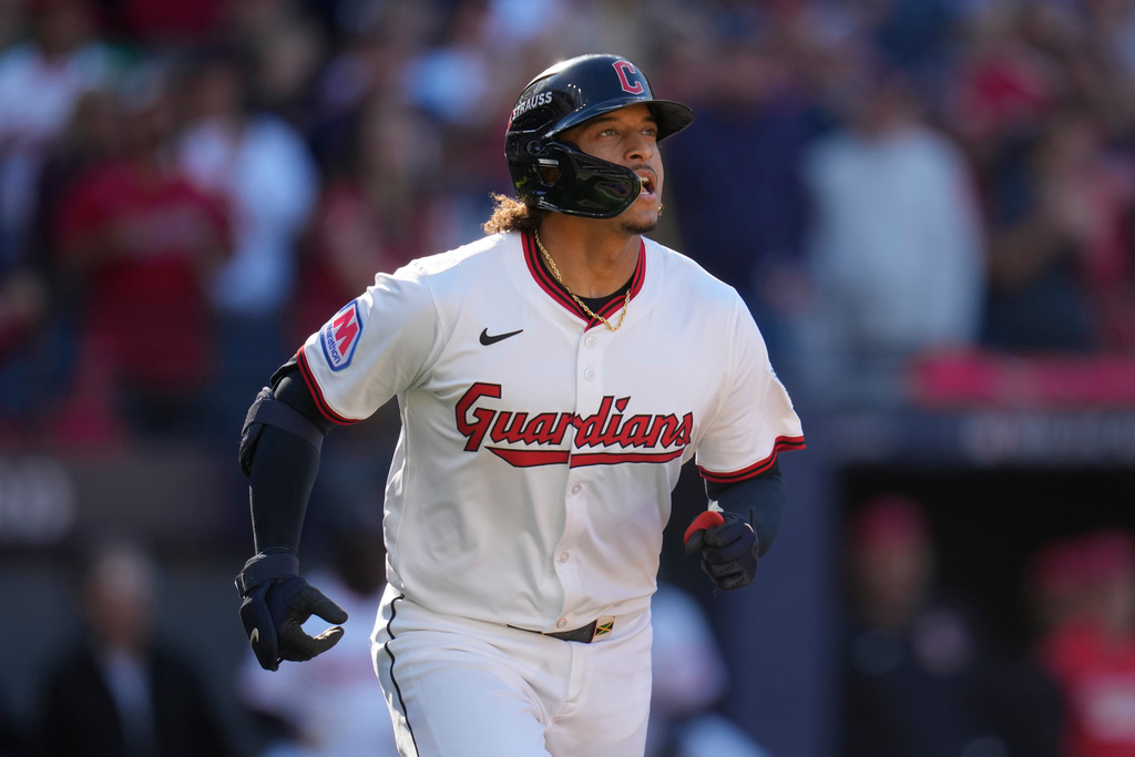 Cleveland Guardians catcher Bo Naylor watches his three-run homer in the eighth inning of Game 2 of the American League Wild Card baseball playoff series against the Detroit Tigers in Cleveland, Wednesday, Oct. 1, 2025. (AP Photo/Sue Ogrocki)