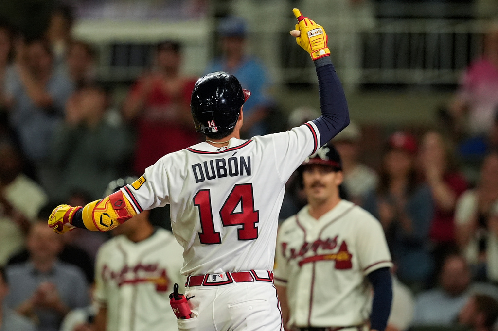 Atlanta Braves' Mauricio Dubón celebrates his two-run home run against the Chicago Cubs in the eighth inning of a baseball game, Wednesday, May 13, 2026, in Atlanta. (AP Photo/Mike Stewart)
