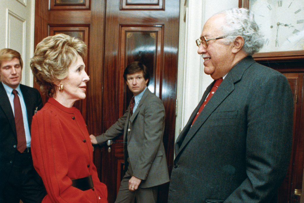 In this 1983 photo provided by The White House, John Woodson Ficklin talks with first lady Nancy Reagan at the White House in Washington. (The White House via AP)