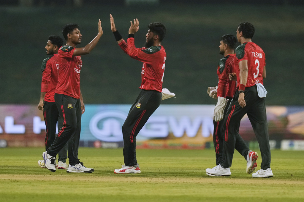 Bangladesh players celebrates the dismissal of Afghanistan's Mohammad Nabi during the Asia Cup Cricket match between Bangladesh and Afghanistan at Zayed Cricket Stadium in Abu Dhabi, United Arab Emirates, Tuesday, Sept. 16, 2025. (AP Photo/Altaf Qadri)