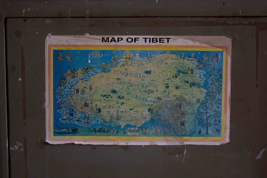 A map of Tibet hangs on the steel wardrobe at a camp in Kathmandu, Nepal, April 15, 2025. (AP Photo/Niranjan Shrestha)