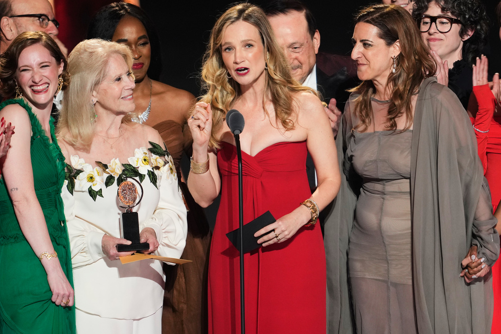 Bess Wohl, center, accepts the award for best play for "Liberation" during the 79th Tony Awards on Sunday, June 7, 2026, at Radio City Music Hall in New York. (Photo by Charles Sykes/Invision/AP)
