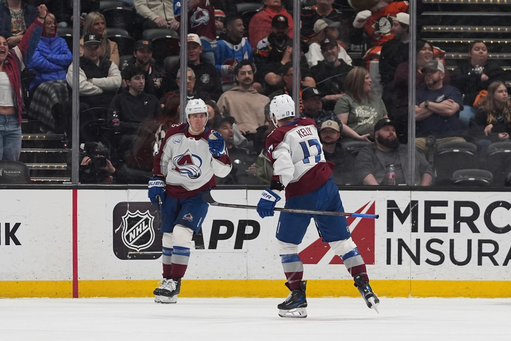 Colorado Avalanche center Parker Kelly (17) celebrates his goal with teammate right wing Valeri Nichushkin during the third period of an NHL hockey game against the Anaheim Ducks Tuesday, March 3, 2026, in Anaheim, Calif. (AP Photo/Gregory Bull)