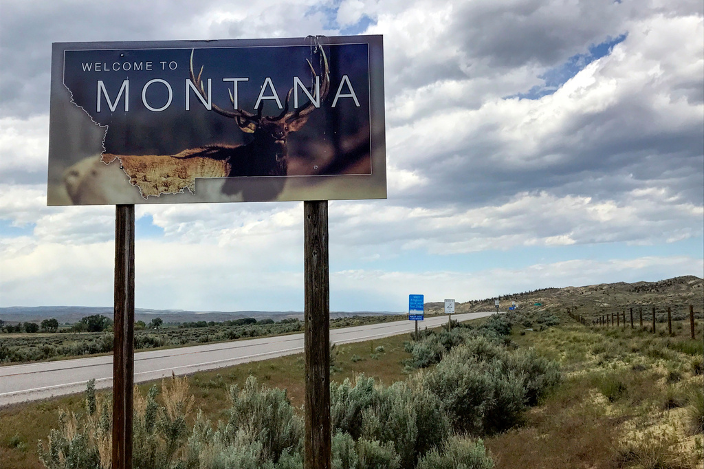 FILE - A "Welcome to Montana" sign is seen along Montana State Highway 72 near Chance, Mont., May 24, 2017. (AP Photo/Robert Yoon, File)