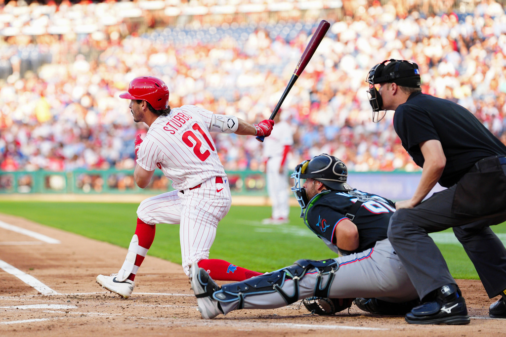 Philadelphia Phillies' Garrett Stubbs (21) watches his RBI-single off Miami Marlins pitcher Sandy Alcantara during the second inning of a baseball game, Wednesday, Aug. 19, 2026, in Philadelphia. (AP Photo/Derik Hamilton)