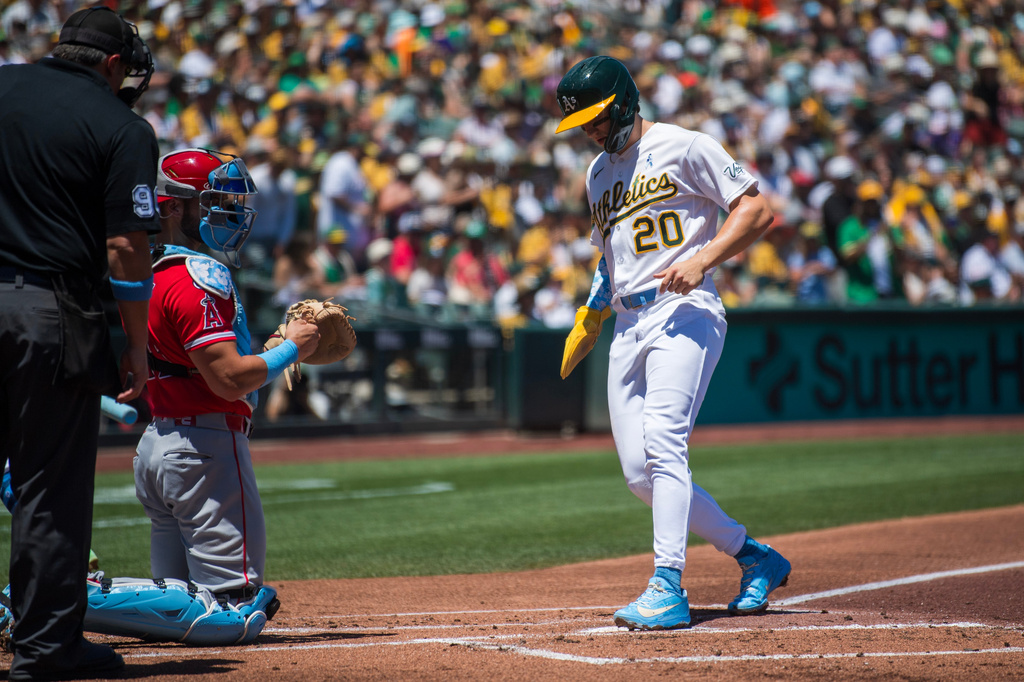 Athletics' Zack Gelof (20) scores during the first inning of a baseball game against the Los Angeles Angels in West Sacramento, Calif., Sunday, June 21, 2026. (AP Photo/Nic Coury)