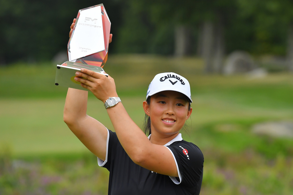 Ruoning Yin, of China, displays the FM Championship golf tournament trophy following her win in the LPGA event, Sunday, Aug. 30, 2026, in Norton, Mass. (AP Photo/Steven Senne)