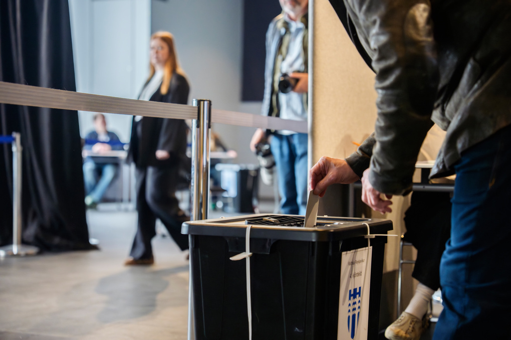 A voter casts his ballot at a polling station inside Reykjavik City Hall in Reykjavik, Iceland, Saturday, Aug. 29, 2026. (AP Photo/Marco Di Marco)
