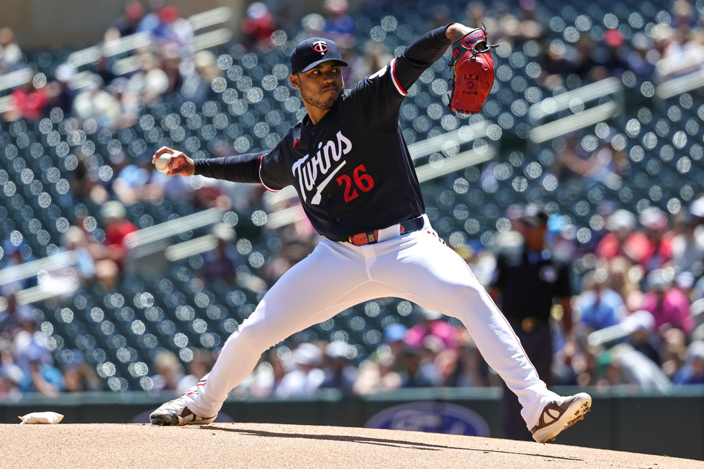 Minnesota Twins pitcher Taj Bradley throws to the St. Louis Cardinals during the first inning of a baseball game Sunday, June 14, 2026, in Minneapolis. (AP Photo/Ellen Schmidt)
