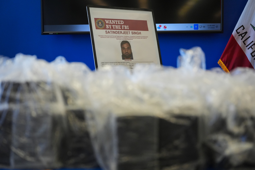 An FBI Wanted poster for Satinderjeet Singh is displayed at a news conference at the Federal Building in Los Angeles, Tuesday, July 7, 2026.(AP Photo/Jae C. Hong)