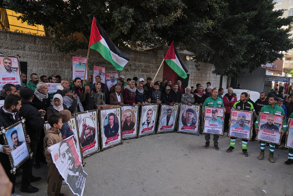 Family members of Palestinian prisoners held in Israeli jails and medical staff take part in a protest organized by the Palestinian Prisoners Committee calling for their release outside the Red Cross headquarters in Gaza City Monday, Jan. 12, 2026. (AP Photo/Jehad Alshrafi)