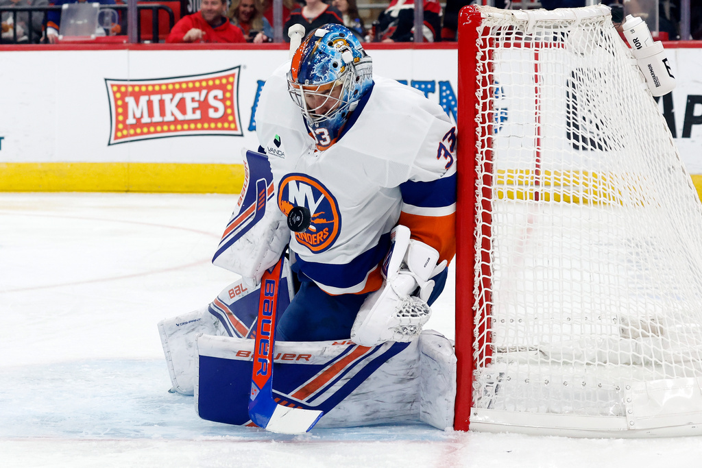 New York Islanders goaltender David Rittich (33) blocks a shot of the Carolina Hurricanes during the second period of an NHL hockey game in Raleigh, N.C., Thursday, Oct. 30, 2025. (AP Photo/Karl DeBlaker)