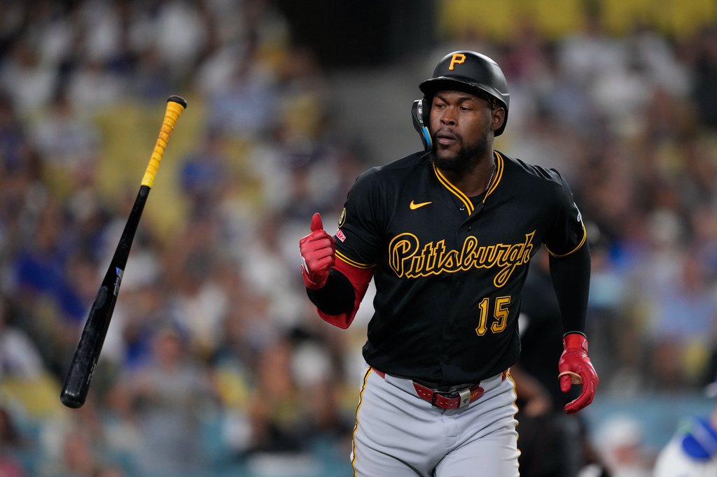 Pittsburgh Pirates' Oneil Cruz tosses his bat after hitting a two-run home run during the eighth inning of a baseball game against the Los Angeles Dodgers, Friday, Aug. 21, 2026, in Los Angeles. (AP Photo/Mark J. Terrill)