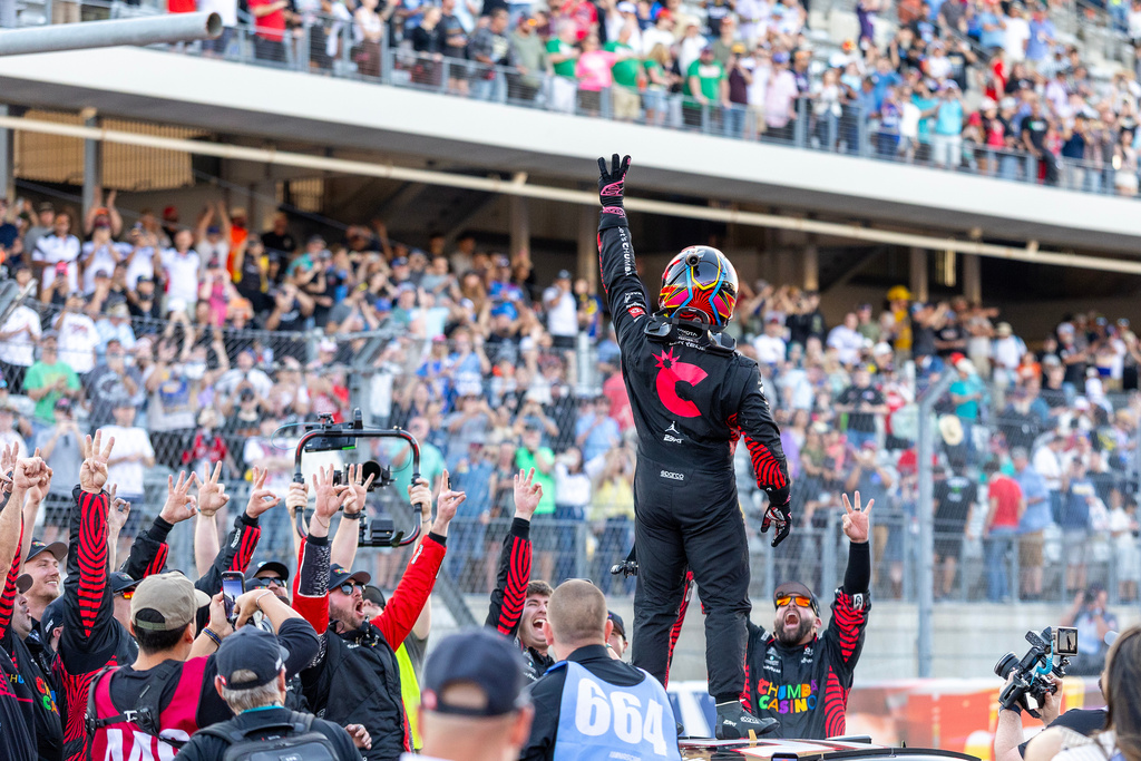 23XI Racing's Tyler Reddick, center, celebrates his win during a NASCAR Cup Series auto race in Austin, Texas, Sunday, March 1, 2026. (AP Photo/Stephen Spillman)