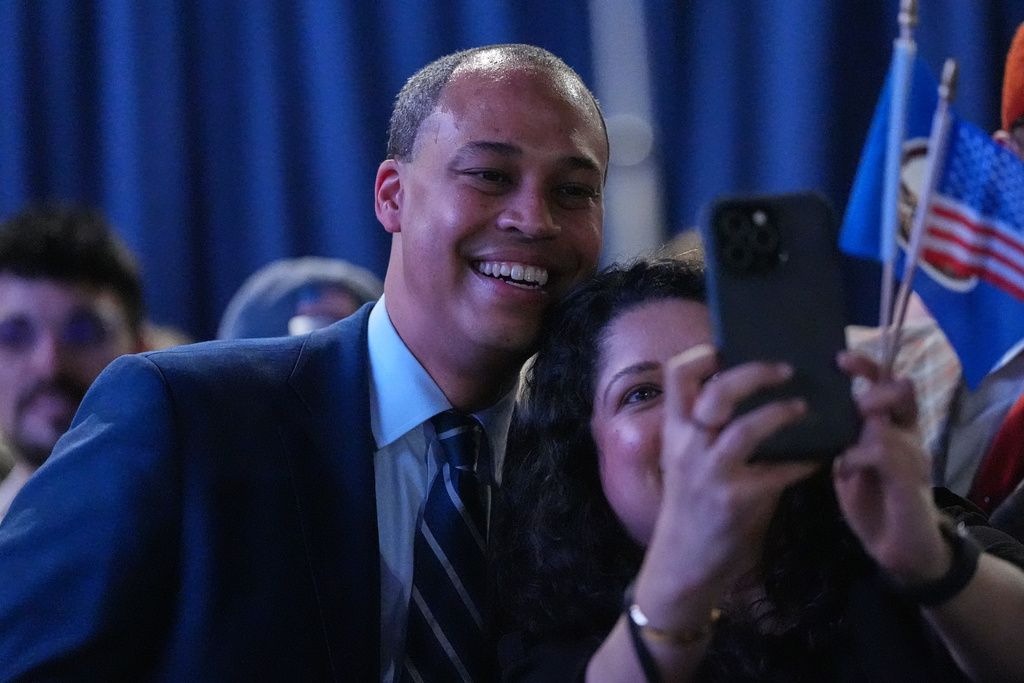Democrat Jay Jones takes a selfie with a supporter at an election night watch party for Democrat Abigail Spanberger after Jones was declared the winner of the Virginia attorney general's race Tuesday, Nov. 4, 2025, in Richmond, Va. (AP Photo/Stephanie Scarbrough)