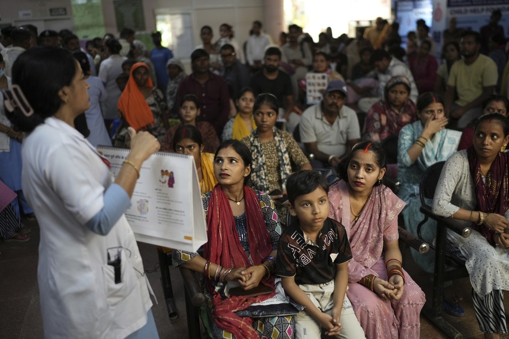 Pregnant women listen to a nurse giving antenatal Care Companion Program (CCP) advise in a government hospital in Gurugram, a satellite city of New Delhi, India, on Aug. 7, 2025. (AP Photo/Manish Swarup)
