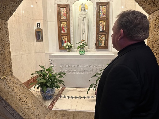 The Rev. John Bettin, rector of the National Shrine of The Little Flower Basilica, looks at a relic of St. Thérèse of Lisieux inside the basilica Tuesday, Sept. 30, 2025, in Royal Oak, Mich. (AP Photo/Mike Householder) The Rev. John Bettin, rector of the National Shrine of The Little Flower Basilica, looks at a relic of St. Thérèse of Lisieux inside the basilica Tuesday, Sept. 30, 2025, in Royal Oak, Mich. (AP Photo/Mike Householder)
