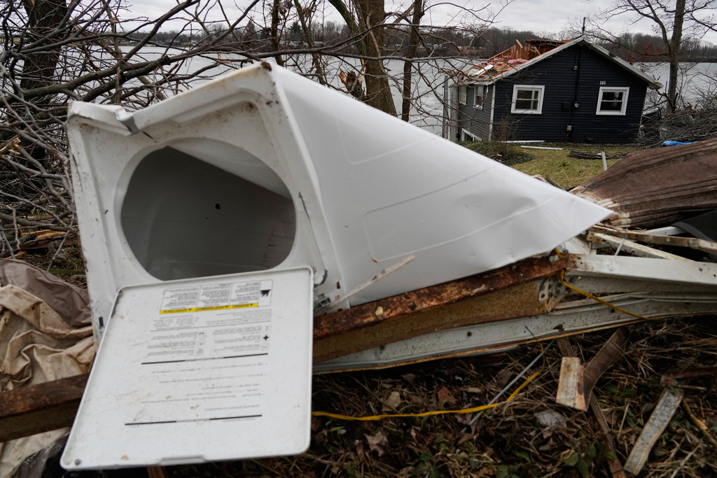 A warped washing machine sits amid debris in the aftermath of a powerful storm that ripped through the area a day earlier, in Union City Mich., Saturday, March 7, 2026. (AP Photo/Nam Y. Huh)