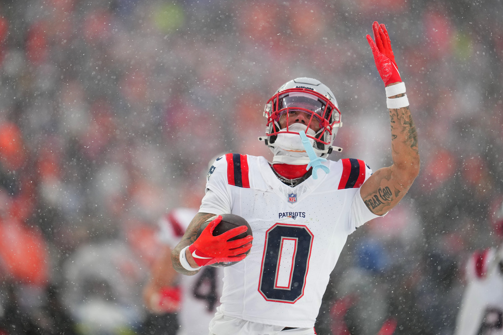 New England Patriots cornerback Christian Gonzalez celebrate after an interception against the Denver Broncos during the second the half of the AFC Championship NFL football game, Sunday, Jan. 25, 2026, in Denver. (AP Photo/Garrett W. Ellwood)