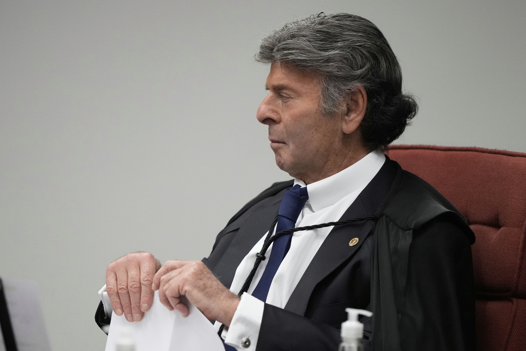 Supreme Court Justice Luiz Fux attends the verdict and sentencing phase of a trial for those charged in an alleged coup plot to keep Brazil's former President Jair Bolsonaro in office after his 2022 election defeat, in Brasilia, Brazil, Thursday, Sept. 11, 2025. (AP Photo/Eraldo Peres)