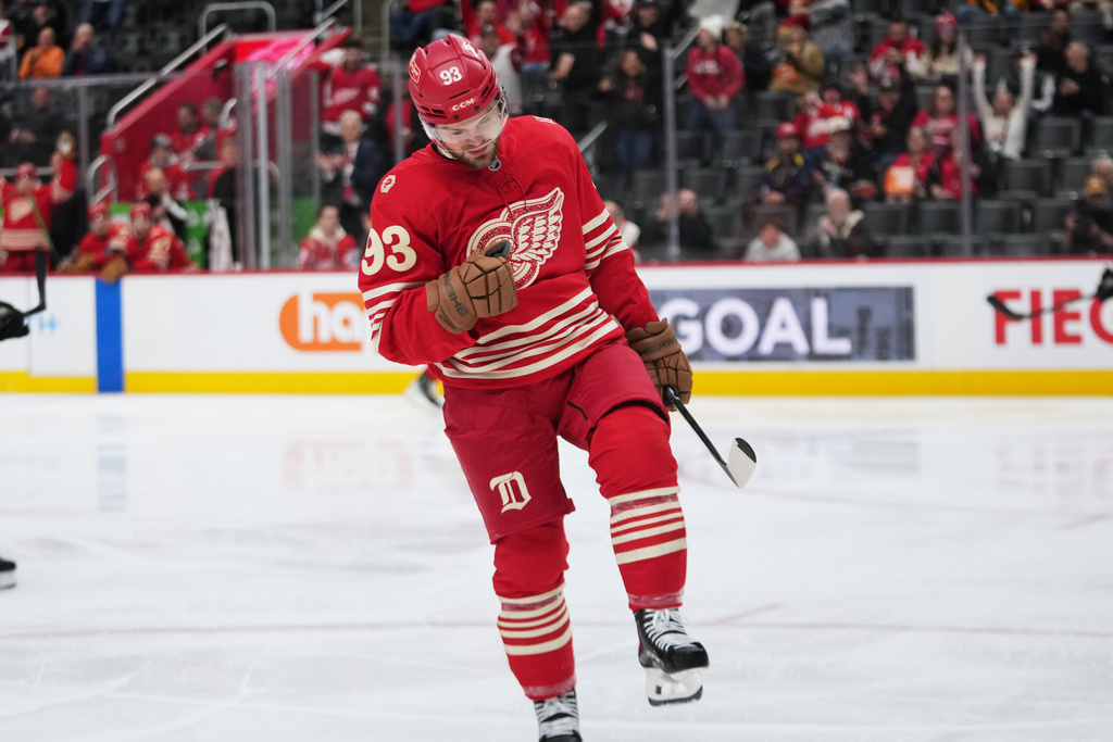 Detroit Red Wings right wing Alex Debrincat (93) celebrates his goal against the Boston Bruins in the second period of an NHL hockey game Tuesday, Dec. 2, 2025, in Detroit. (AP Photo/Paul Sancya)