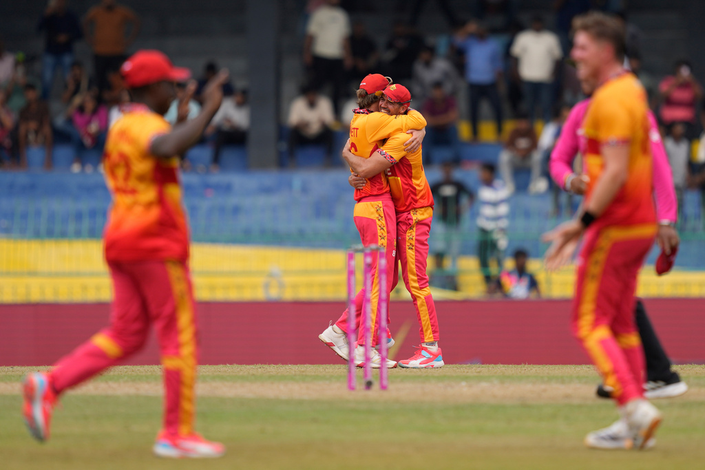 Zimbabwe's players celebrates after won the T20 World Cup cricket match against Australia in Colombo, Sri Lanka, Friday, Feb. 13, 2026. (AP Photo/Eranga Jayawardena)